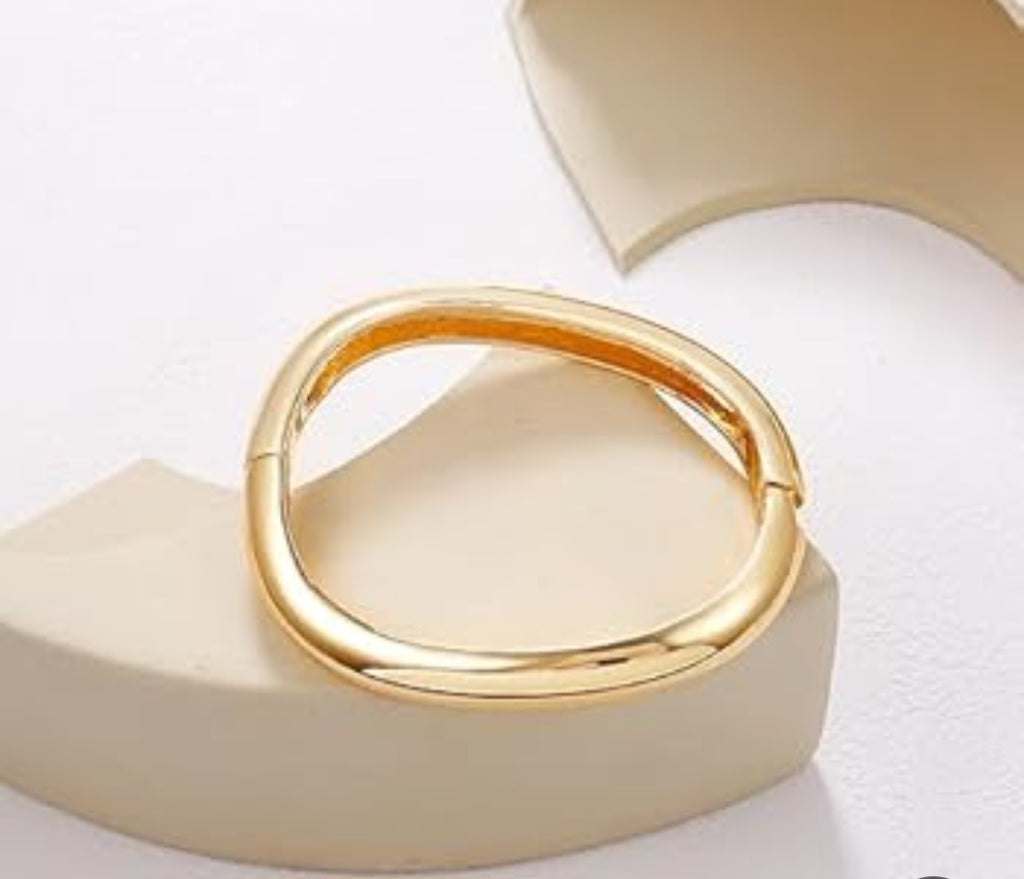 "Gold Stainless Steel Bangle – Elegant and Luxurious Design."