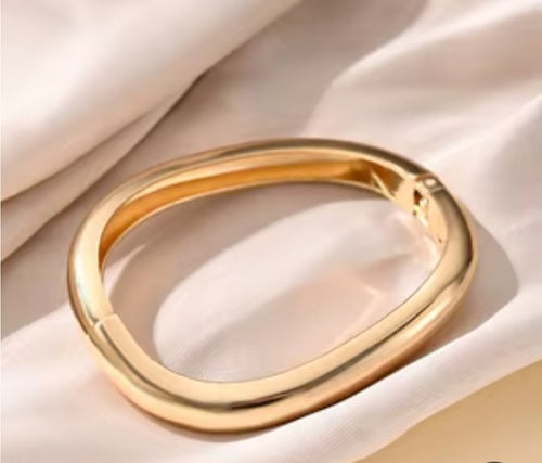 "Gold Stainless Steel Bangle – Elegant and Luxurious Design."
